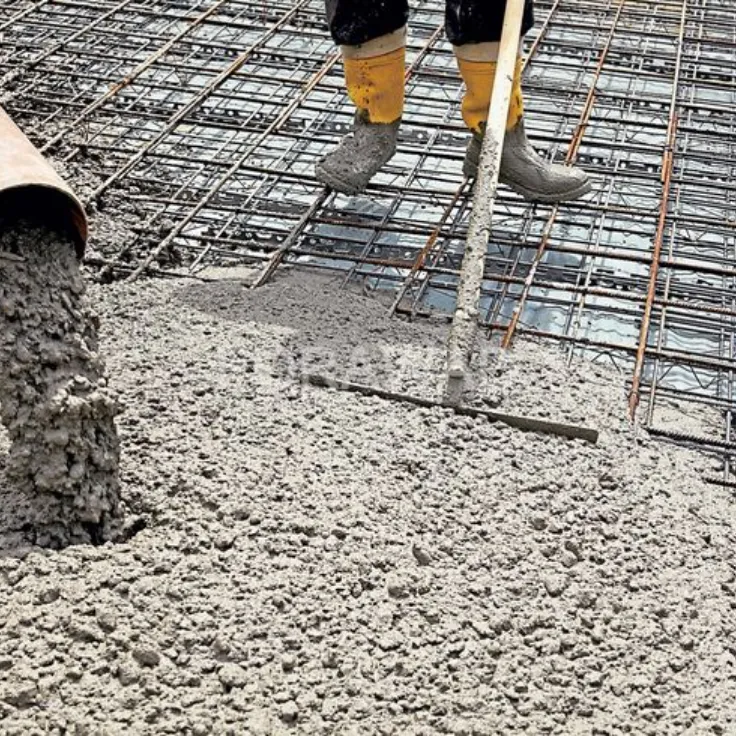 Liquid concrete admixture being added to a concrete mix